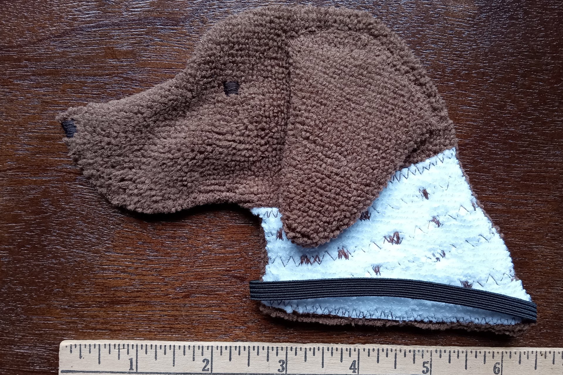 Smudge Dog with ruler to show size.