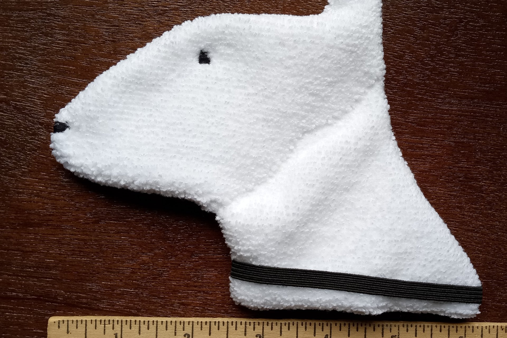 Smudge Dog with ruler to show size.