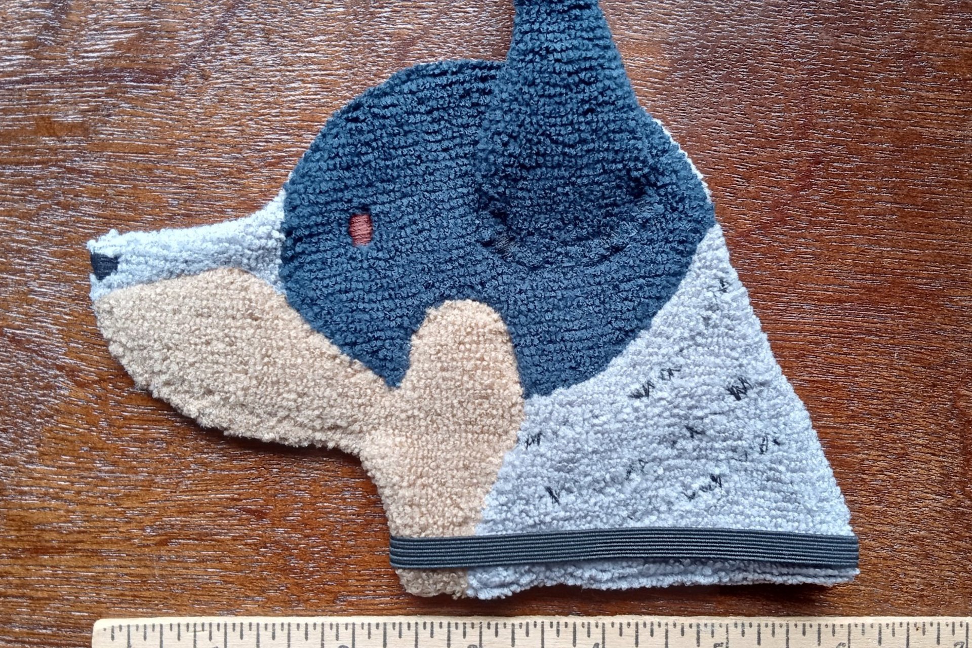 Smudge Dog with ruler to show size.