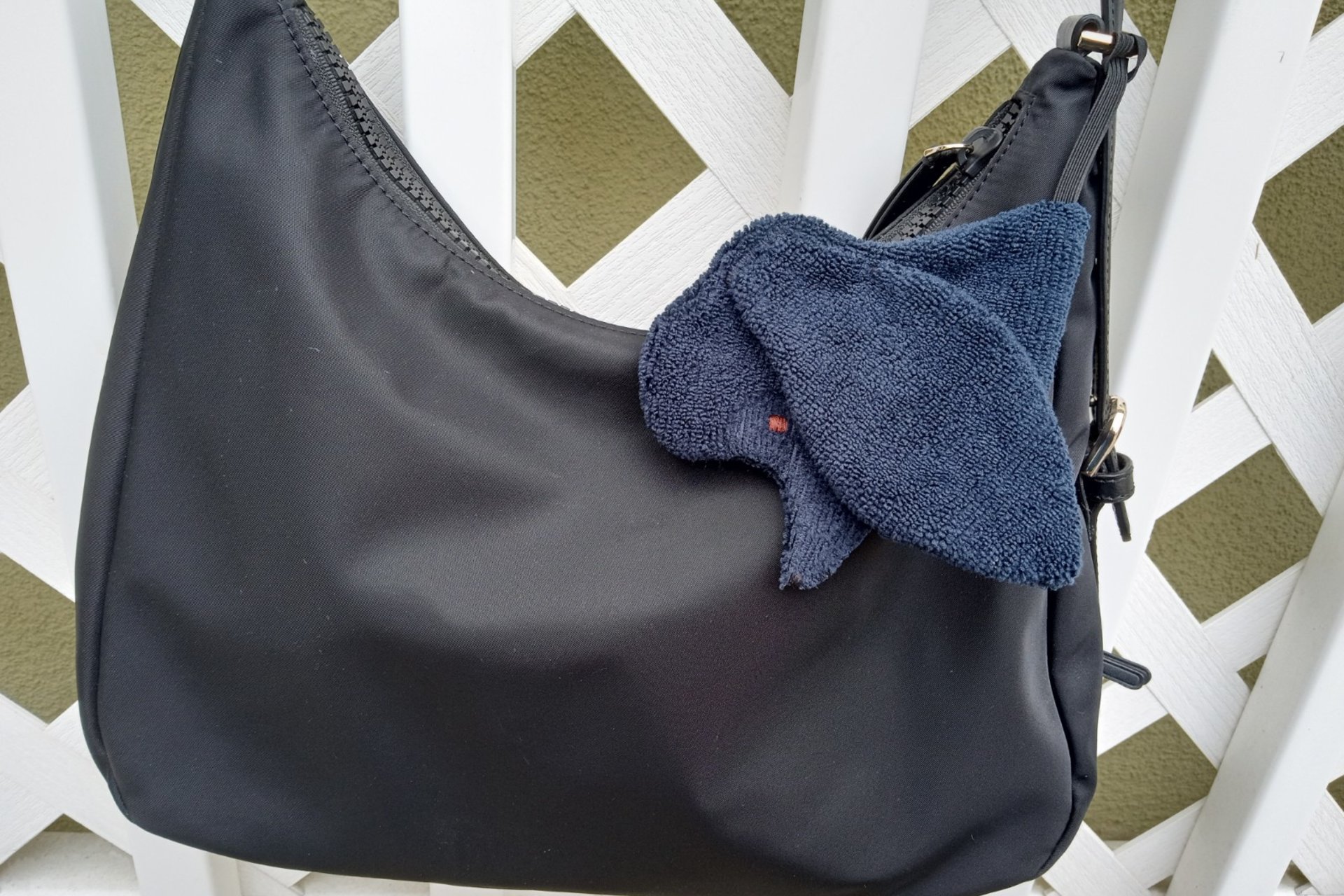 Smudge dog attached to a handbag always within reach.