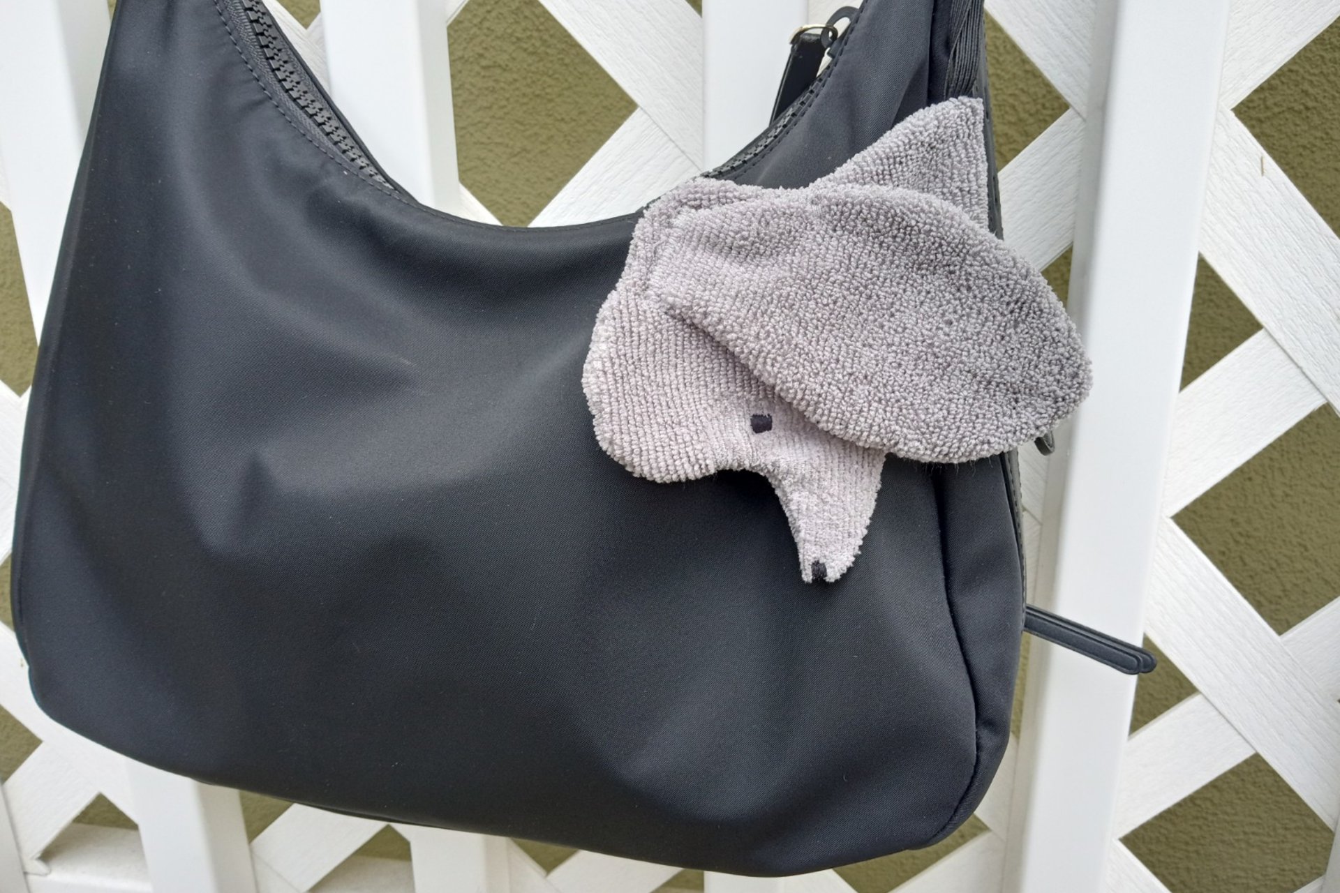 Smudge dog attached to a handbag always within reach.