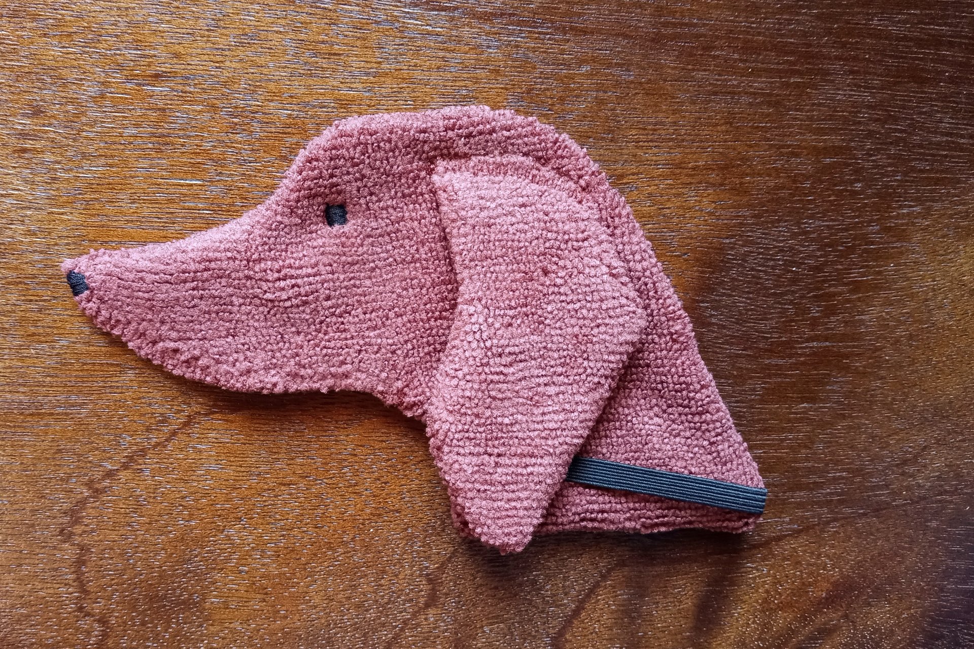 Soft, microfiber terry cloth towels cut, sewn, and made in the shape of a dog