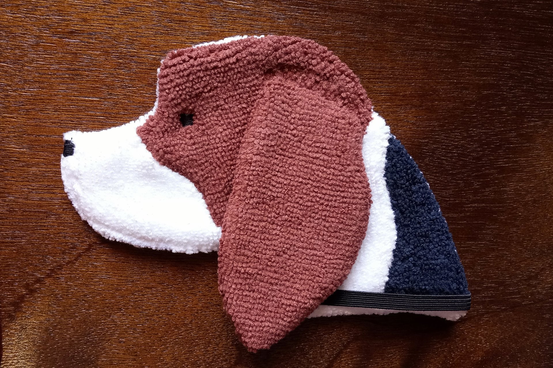 Soft, microfiber terry cloth towels cut, sewn, and made in the shape of a dog