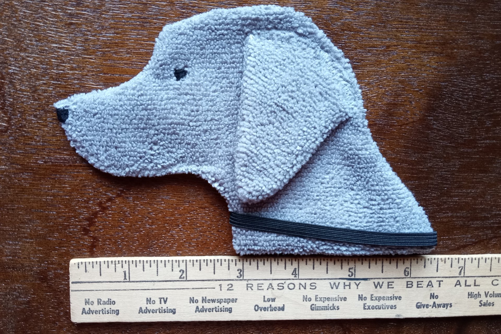 Smudge Dog with ruler to show size.
