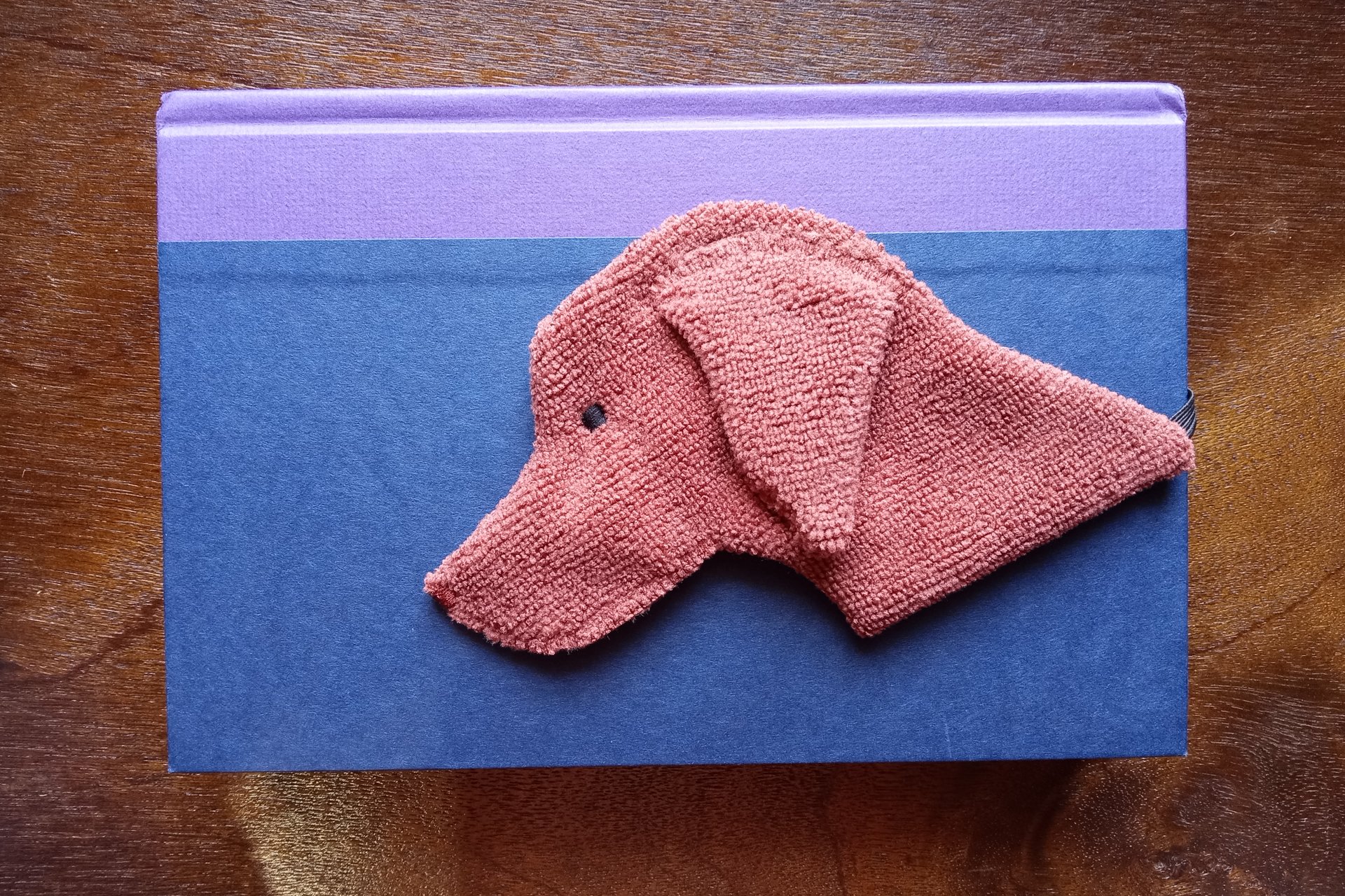 Smudge Dog being used as a bookmark.