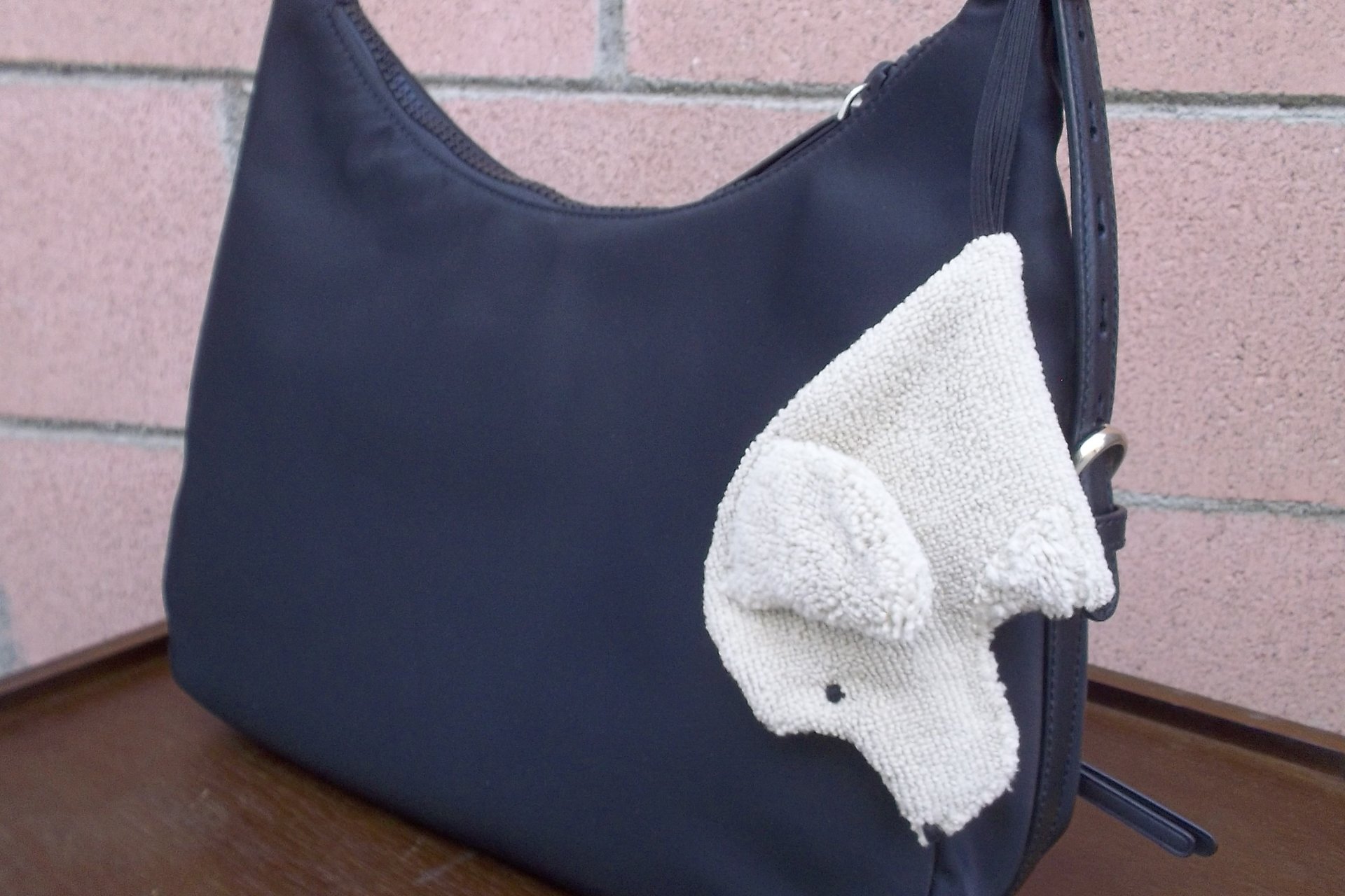 Smudge Dog attached to a handbag. Always ready and easy to find.
