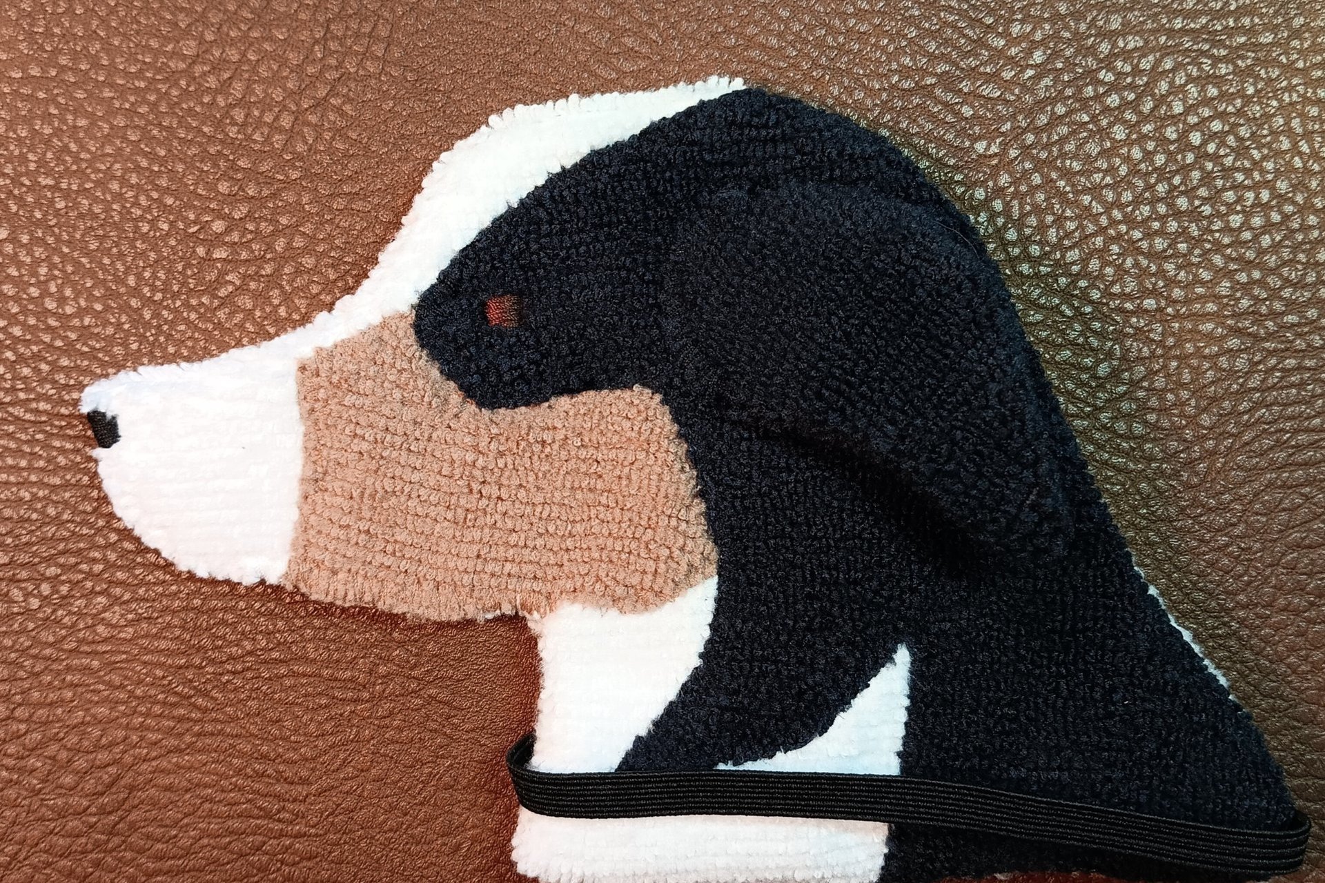 Soft, microfiber terry cloth towels cut, sewn, and made in the shape of the head of an Australian Shepherd. Little larger than palm sized. Texture of the Smudge Dog is perfect for cleaning cell phone screens, musical instruments, glasses, etc.