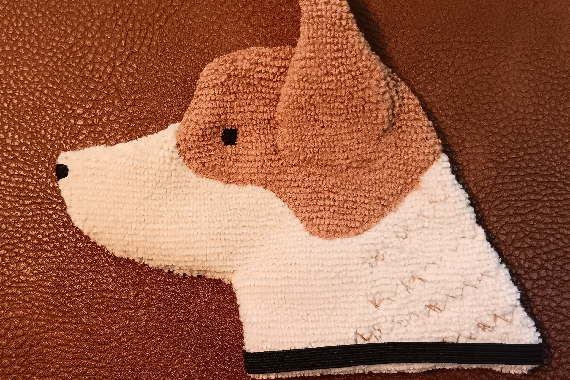 Soft, microfiber terry cloth towels cut, sewn, and made in the shape of the head of a Red Heeler. Little larger than palm sized. Texture of the Smudge Dog is perfect for cleaning cell phone screens, musical instruments, glasses, etc.