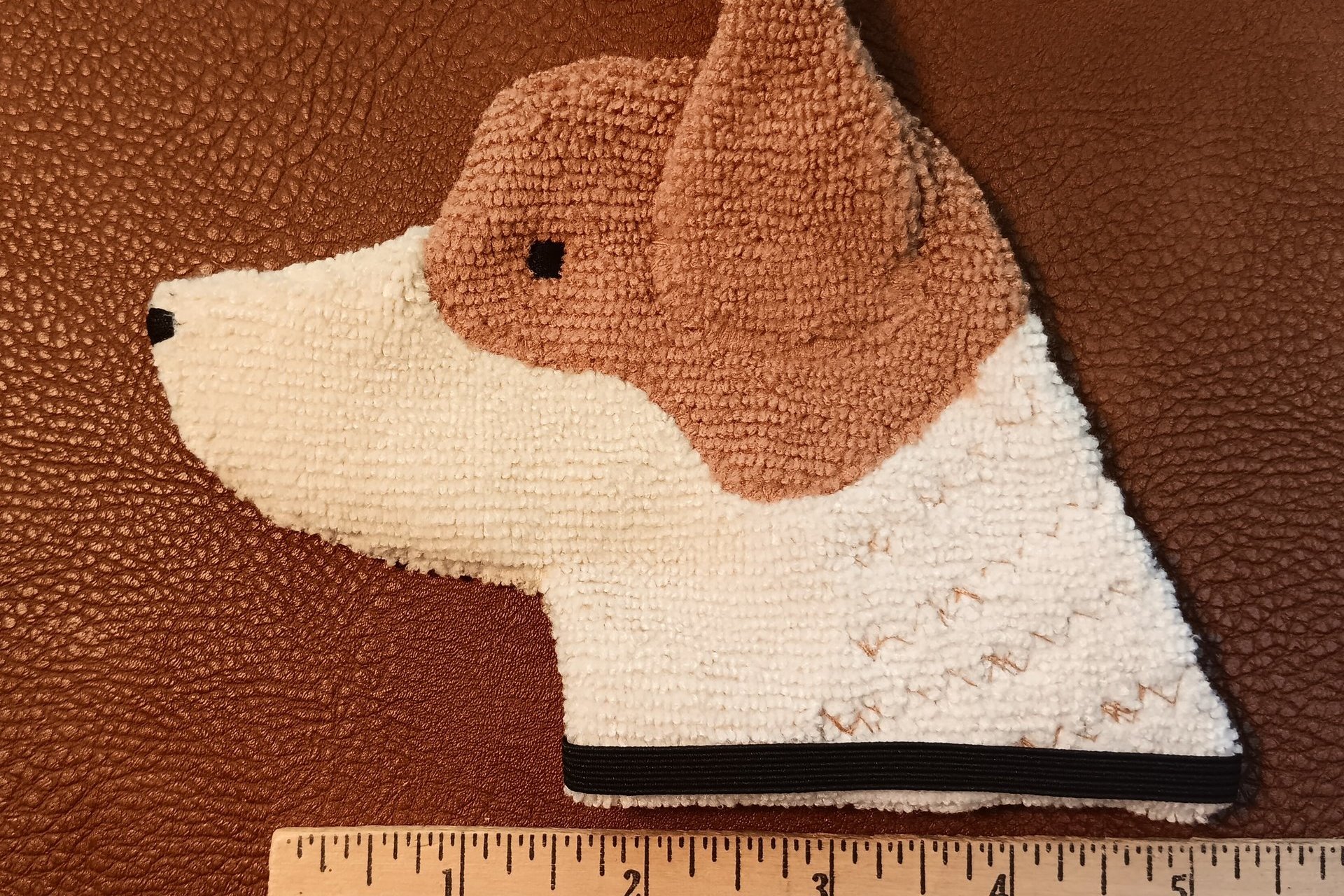 Smudge Dog shown with ruler to illustrate size