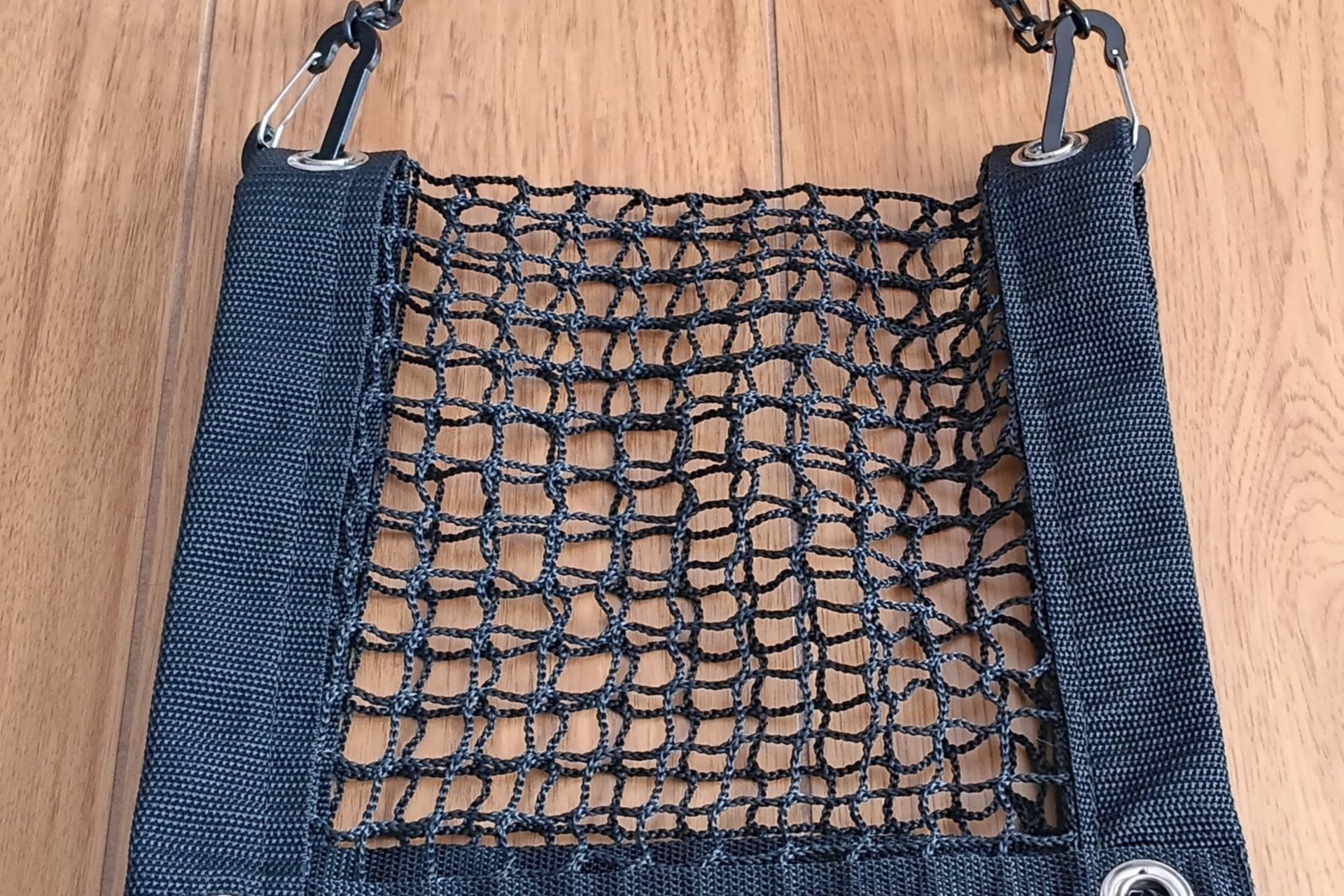 Purse and All Safety Net resembling a purse when folded in half and using included plastc chain as purse strap