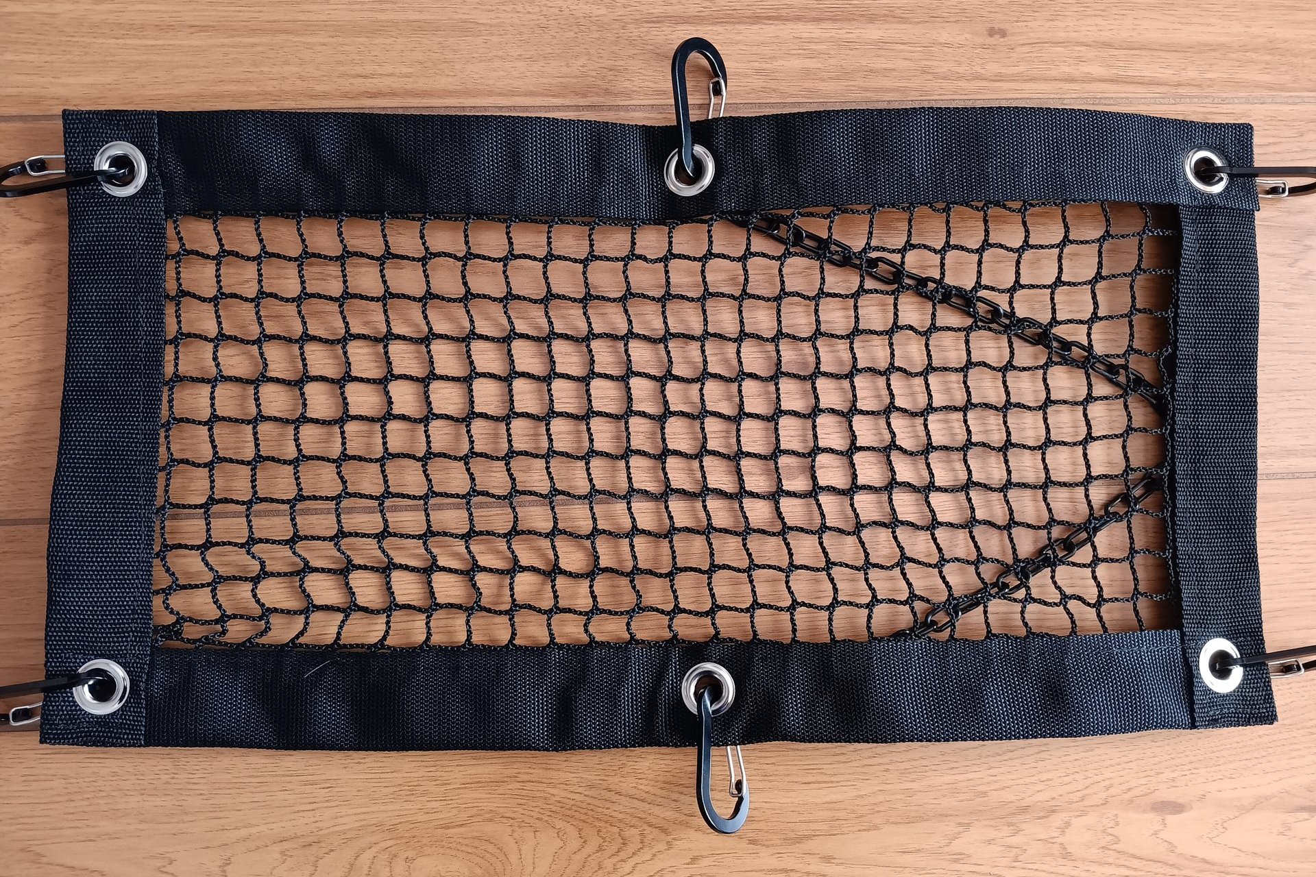 Purse and All Safety Net laid flat to show grommets and carabiners