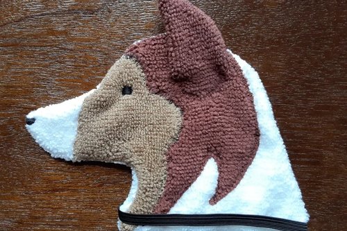 Soft, microfiber terry cloth towels cut, sewn, and made in the shape of a dog