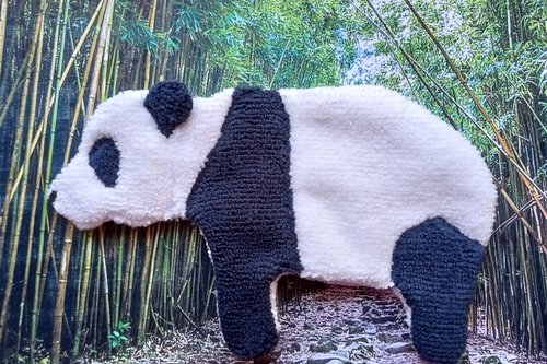 Soft, microfiber terry cloth towels  made in the shape of a Panda.