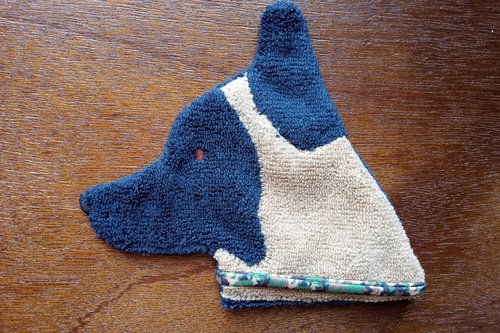 Soft, microfiber terry cloth towels cut, sewn, and made in the shape of a dog