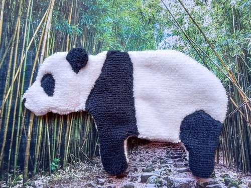 Soft, microfiber terry cloth towels  made in the shape of a Panda.